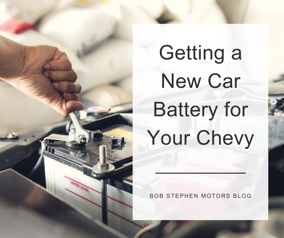 A photo of a car batter being installed and the text: Getting a New Car Battery for Your Chevy