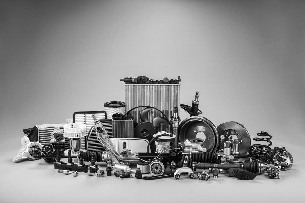 A black and white photo of car parts.